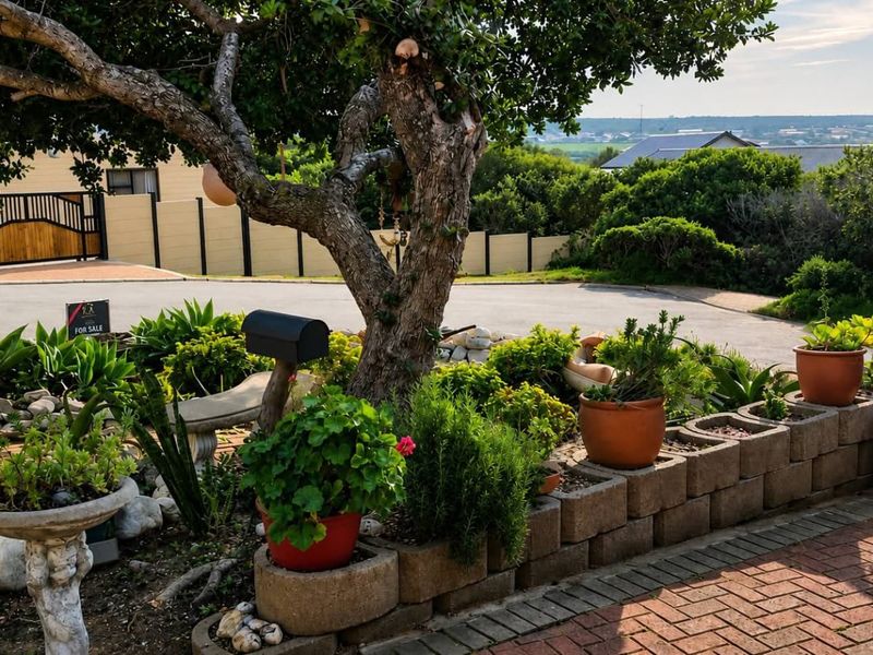 A well-maintained front garden featuring brick paving, tiered retaining wall planters, and established trees, providing a welcoming entrance to the property.