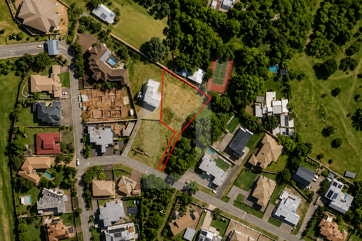 Aerial view of a vacant residential land plot situated within a developed estate, highlighting the property boundaries and surrounding neighborhood context.