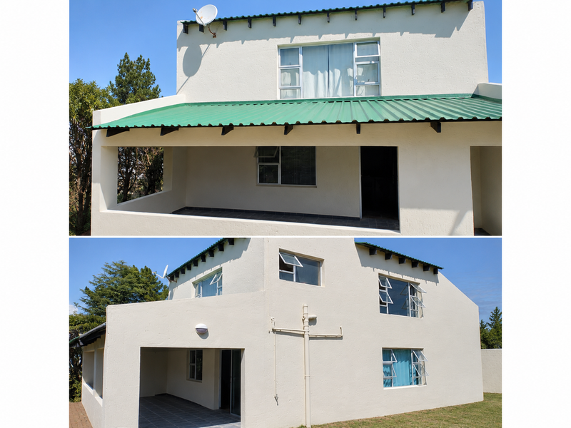 Rear elevation of a two-story house featuring a covered patio, corrugated metal roofing, and multiple casement windows set against a clear sky.