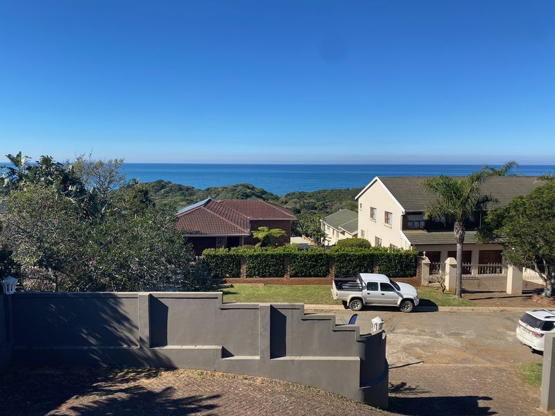 Elevated view overlooking the surrounding residential neighbourhood with a clear outlook towards the ocean horizon.