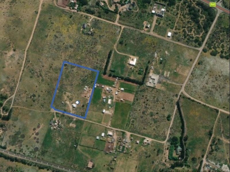 Aerial view of the small holding property showing the land boundaries and surrounding rural landscape.