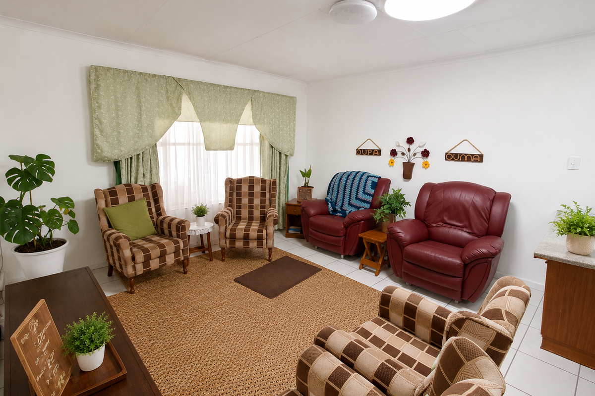 A comfortable living room featuring tiled flooring and neutral walls, providing a functional and well-lit space for relaxation.