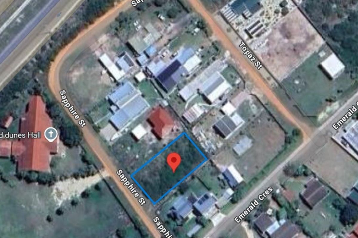 Aerial view of a vacant residential plot located on Sapphire Street, showing the surrounding neighborhood and street access.