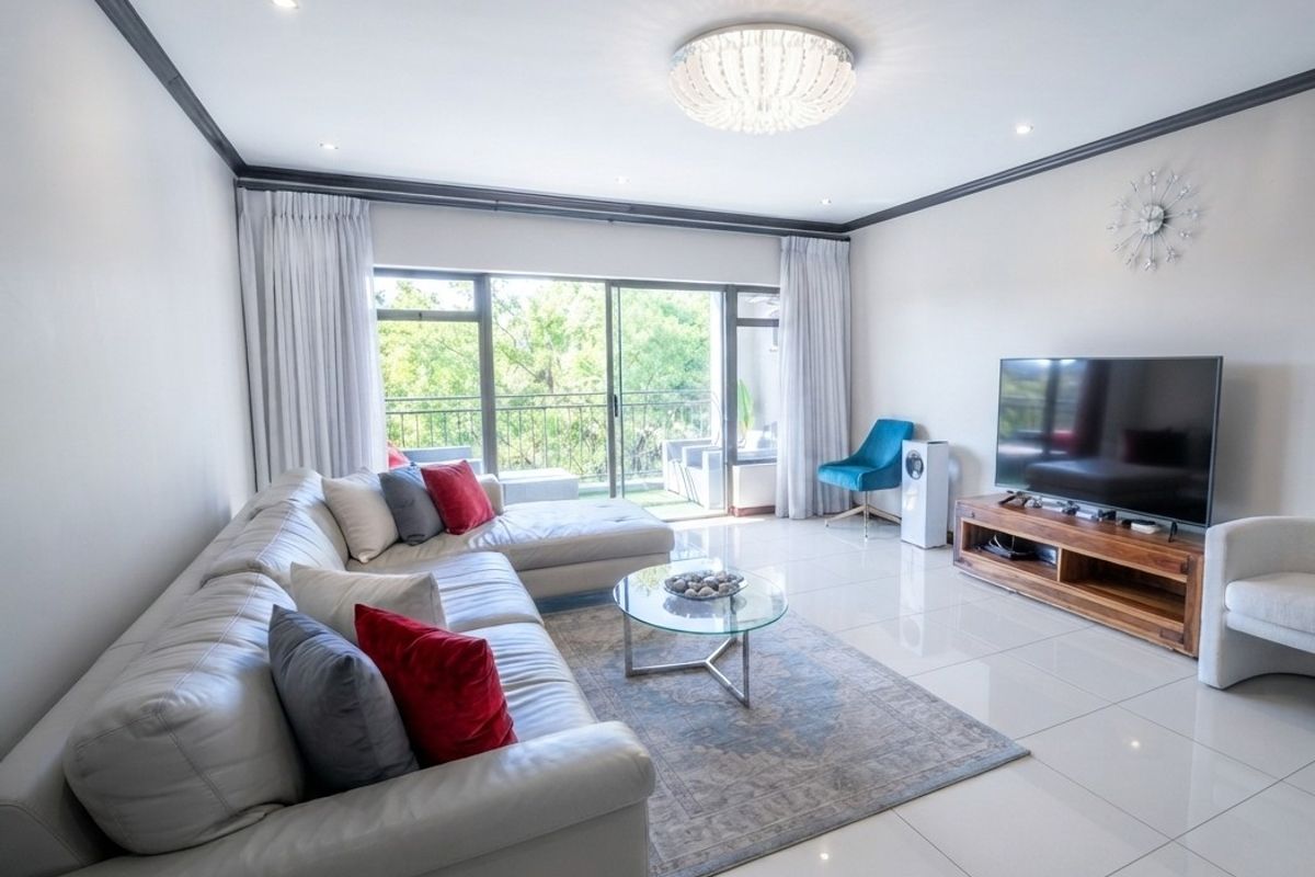 A bright and modern living room featuring polished porcelain floor tiles, crown molding, recessed lighting, and large sliding glass doors leading to a balcony.