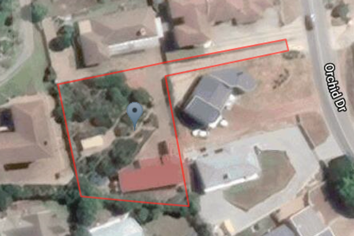 An aerial satellite view showing the property layout, driveway access, and surrounding residential context on Orchid Drive.
