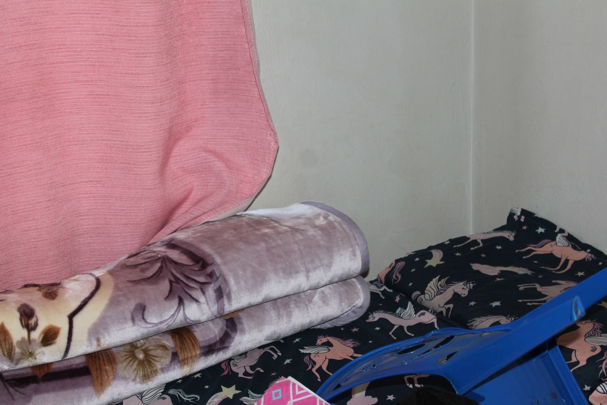 A close-up view of a corner in a bedroom space.