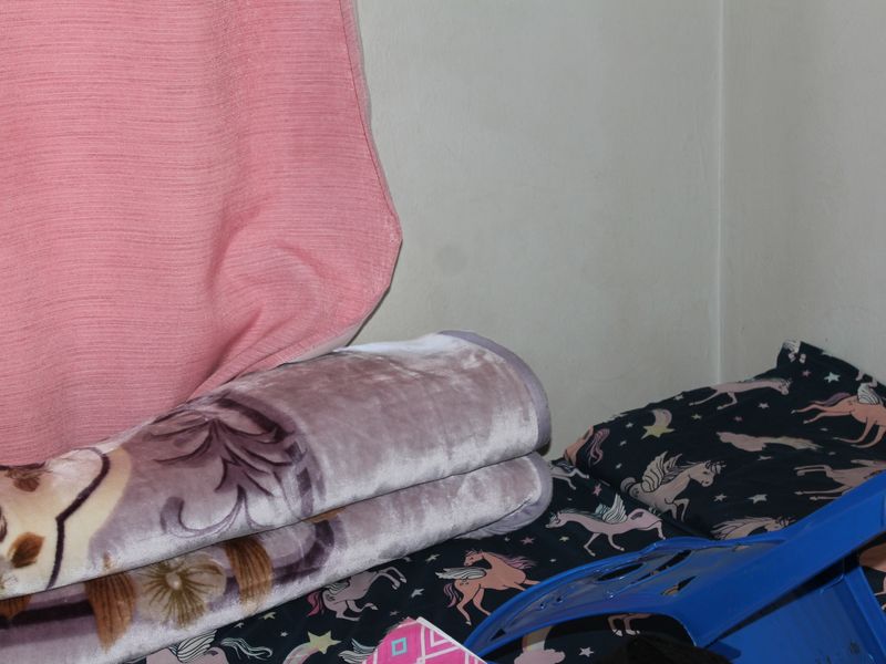 A close-up view of a corner in a bedroom space.