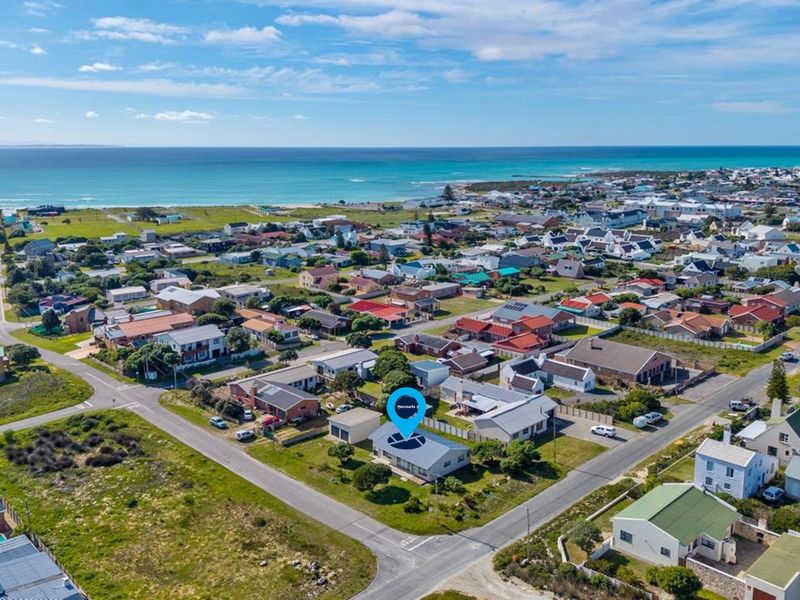 Aerial view of the property location within the coastal neighbourhood, highlighting proximity to the ocean and surrounding residential infrastructure.