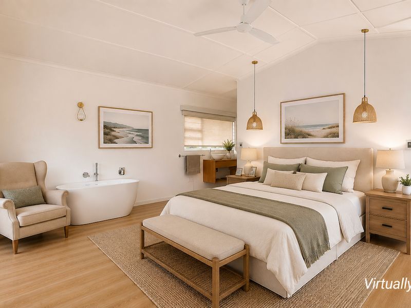 Spacious master bedroom featuring a freestanding bathtub, built-in wardrobes, ceiling fan, and direct access to an outdoor area through sliding glass doors.