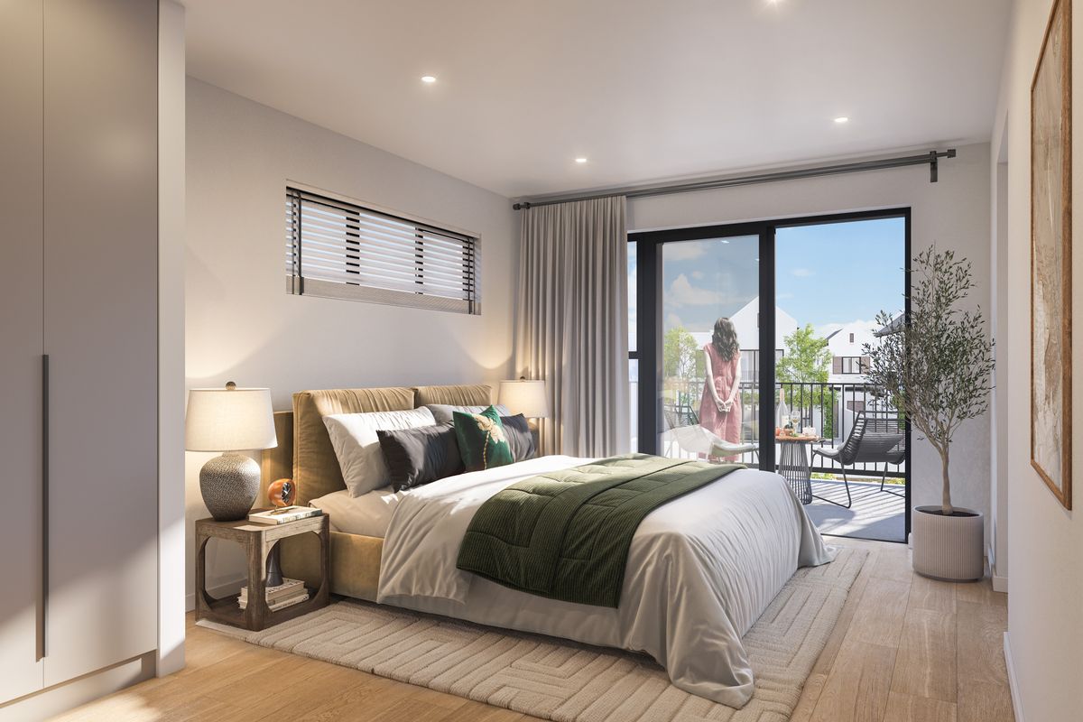 Modern bedroom featuring timber flooring, built-in wardrobe, recessed lighting, and direct access to a private balcony through sliding glass doors.