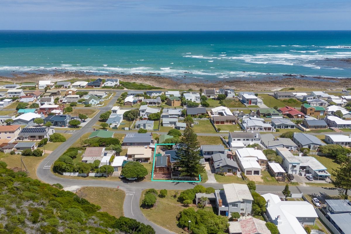 Aerial view of a coastal residential property highlighting its proximity to the ocean and surrounding neighbourhood layout.