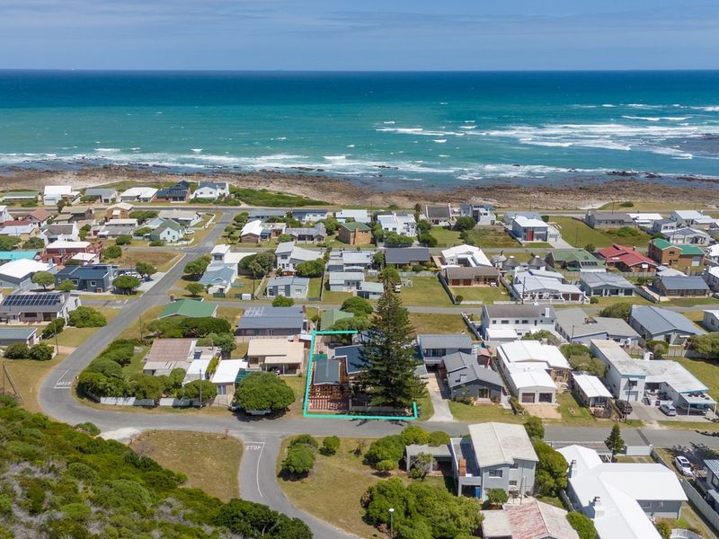 Aerial view of a coastal residential property highlighting its proximity to the ocean and surrounding neighbourhood layout.