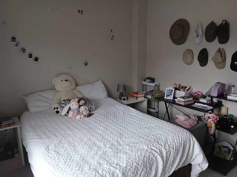 A standard bedroom featuring neutral wall tones and ample space for a double bed and bedside storage.