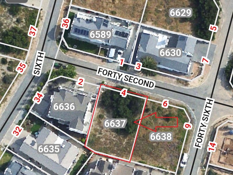 Aerial view of a vacant residential land plot with marked boundaries, situated in a developed neighborhood.