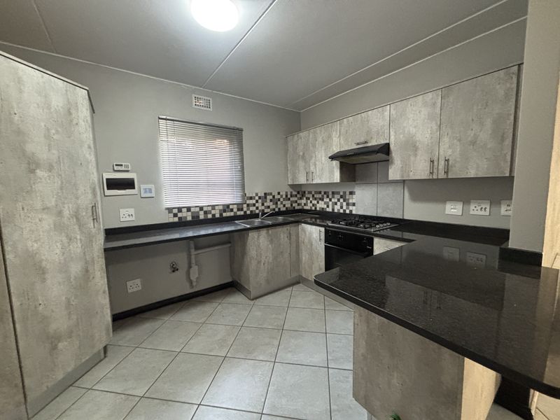 Modern, Secure & Energy-Savvy 2-Bedroom Home in Prime Brentwood Park Location - Photo 7
