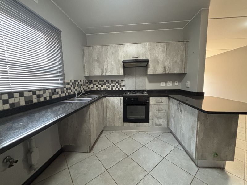 Modern, Secure & Energy-Savvy 2-Bedroom Home in Prime Brentwood Park Location - Photo 6