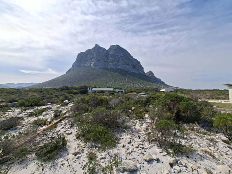 A scenic view of a prominent mountain peak overlooking the natural, undeveloped residential land.