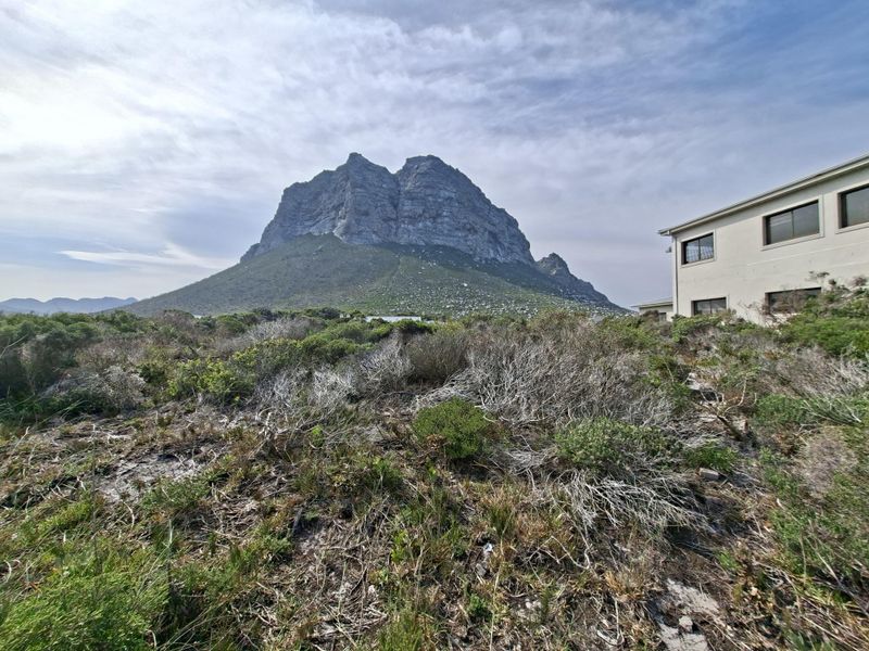 A scenic view of the mountain landscape from the residential property, showcasing natural vegetation and the surrounding environment.