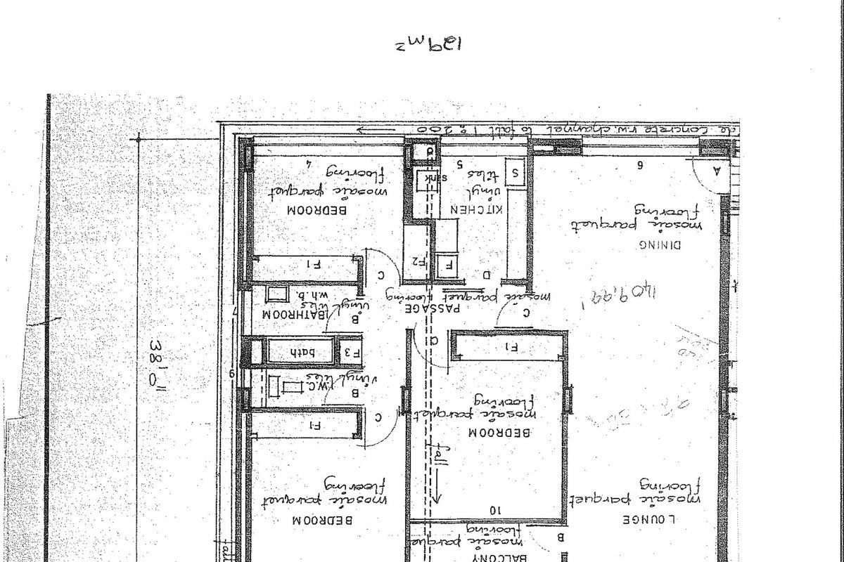 A detailed architectural floor plan showing the layout of a flat, including bedrooms, lounge, kitchen, bathroom, and balcony areas.