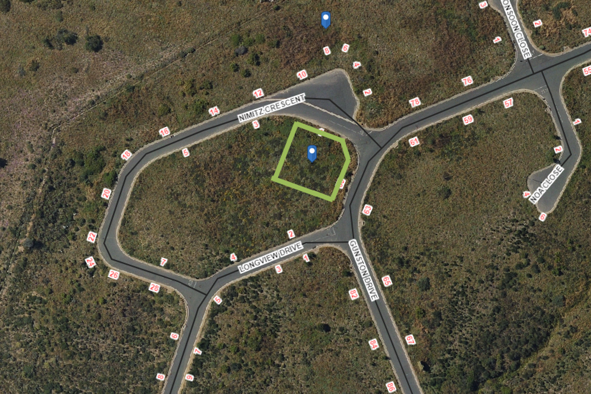 Aerial view of a vacant residential plot situated at the corner of Nimitz Crescent and Longview Drive, showing surrounding street infrastructure.
