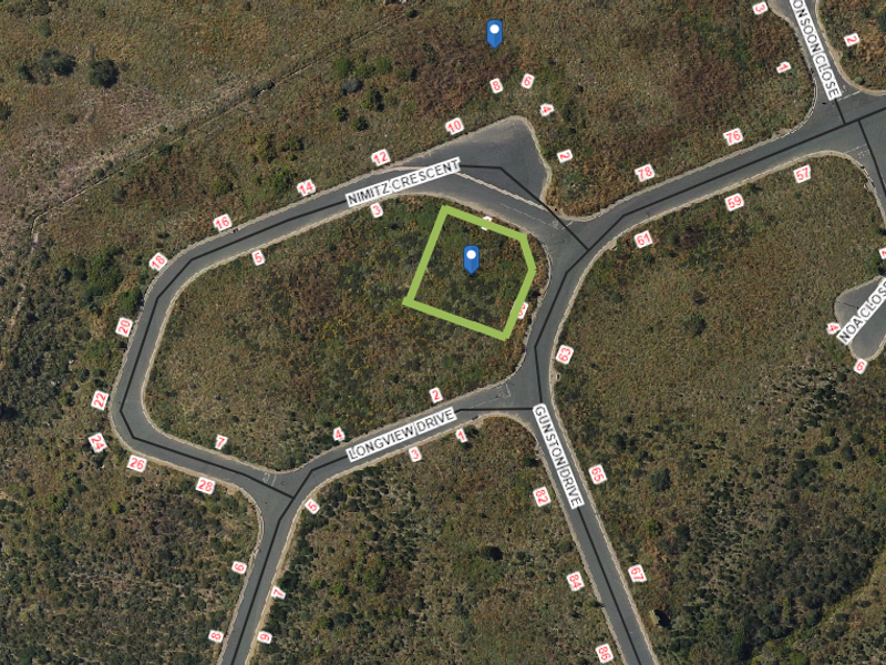 Aerial view of a vacant residential plot situated at the corner of Nimitz Crescent and Longview Drive, showing surrounding street infrastructure.