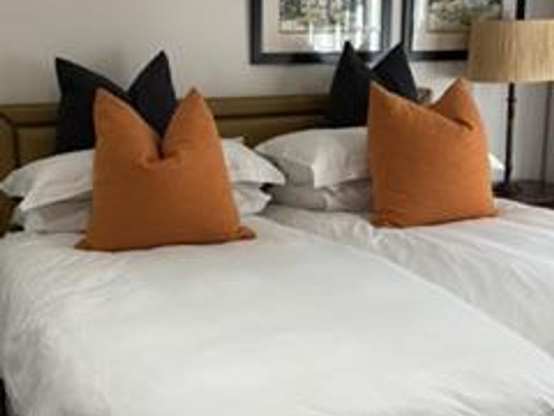 A bedroom featuring a twin bed setup with neutral wall finishes.