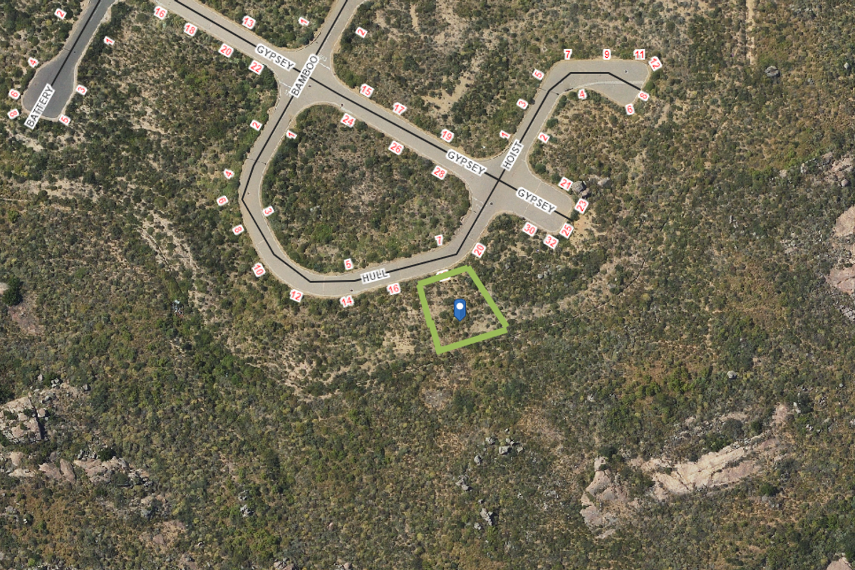 An aerial view showing the location of the vacant residential plot within the surrounding landscape and street network.