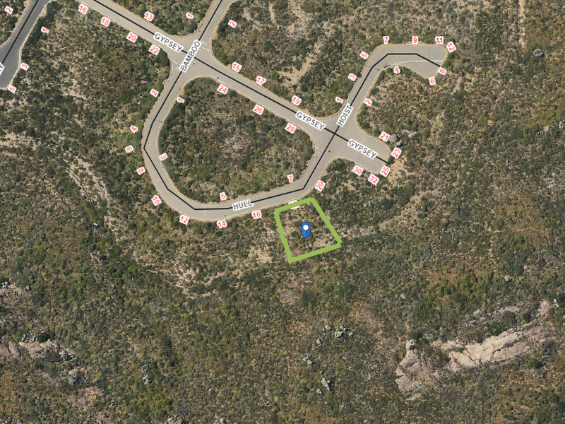 An aerial view showing the location of the vacant residential plot within the surrounding landscape and street network.