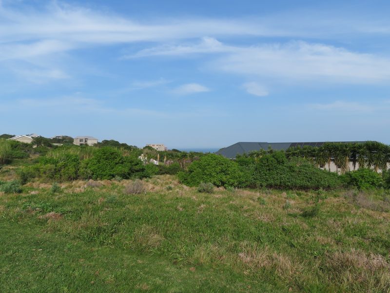A view of the surrounding residential landscape and coastal horizon from the vacant residential land plot.