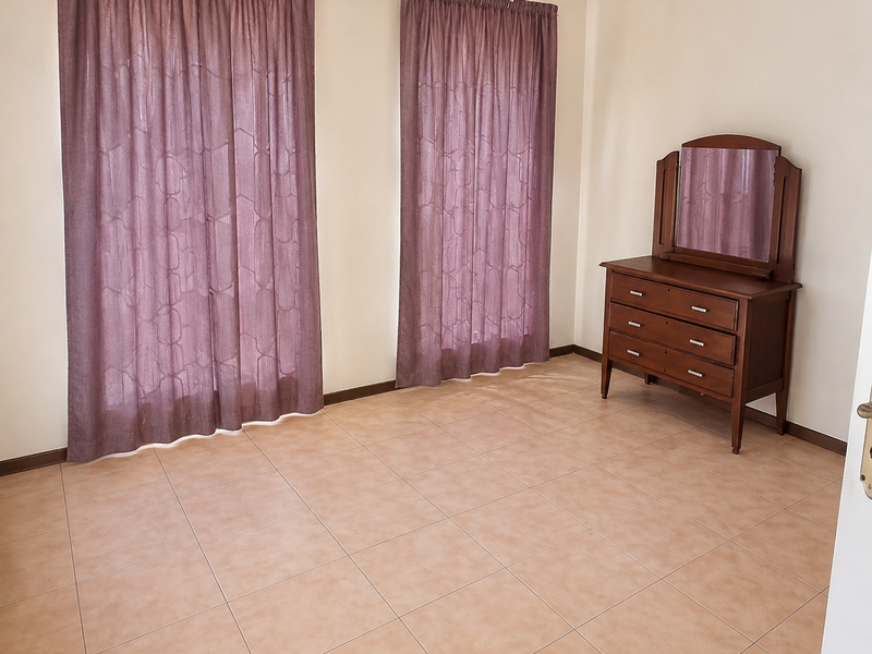 A bedroom featuring neutral walls, tiled flooring, and two sets of curtains, providing a clean and functional space.