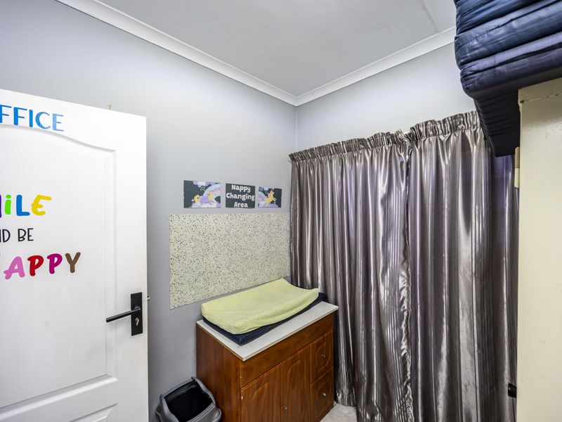 A functional bedroom space featuring neutral wall finishes, coving, and standard internal door access, suitable for use as a bedroom or home office.