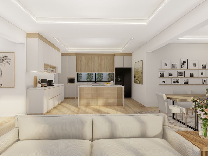 A modern open-plan living and kitchen area featuring light wood cabinetry, a central kitchen island, recessed ceiling lighting, and high-quality finishes throughout.