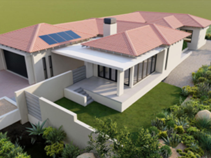An aerial perspective of a modern residential property featuring a tiled roof with solar panels, a garage, and a covered patio area.