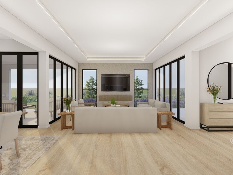 Spacious open-plan living area featuring modern recessed lighting, large format flooring, and expansive black-framed sliding doors providing seamless indoor-outdoor flow.