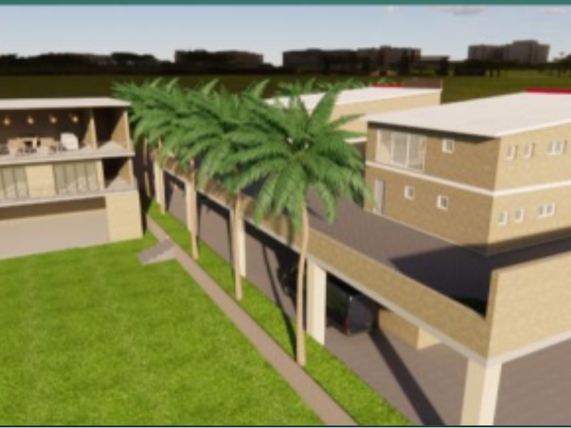 An aerial perspective of a modern multi-level property complex featuring clean architectural lines, flat roofing, and integrated outdoor balcony spaces.