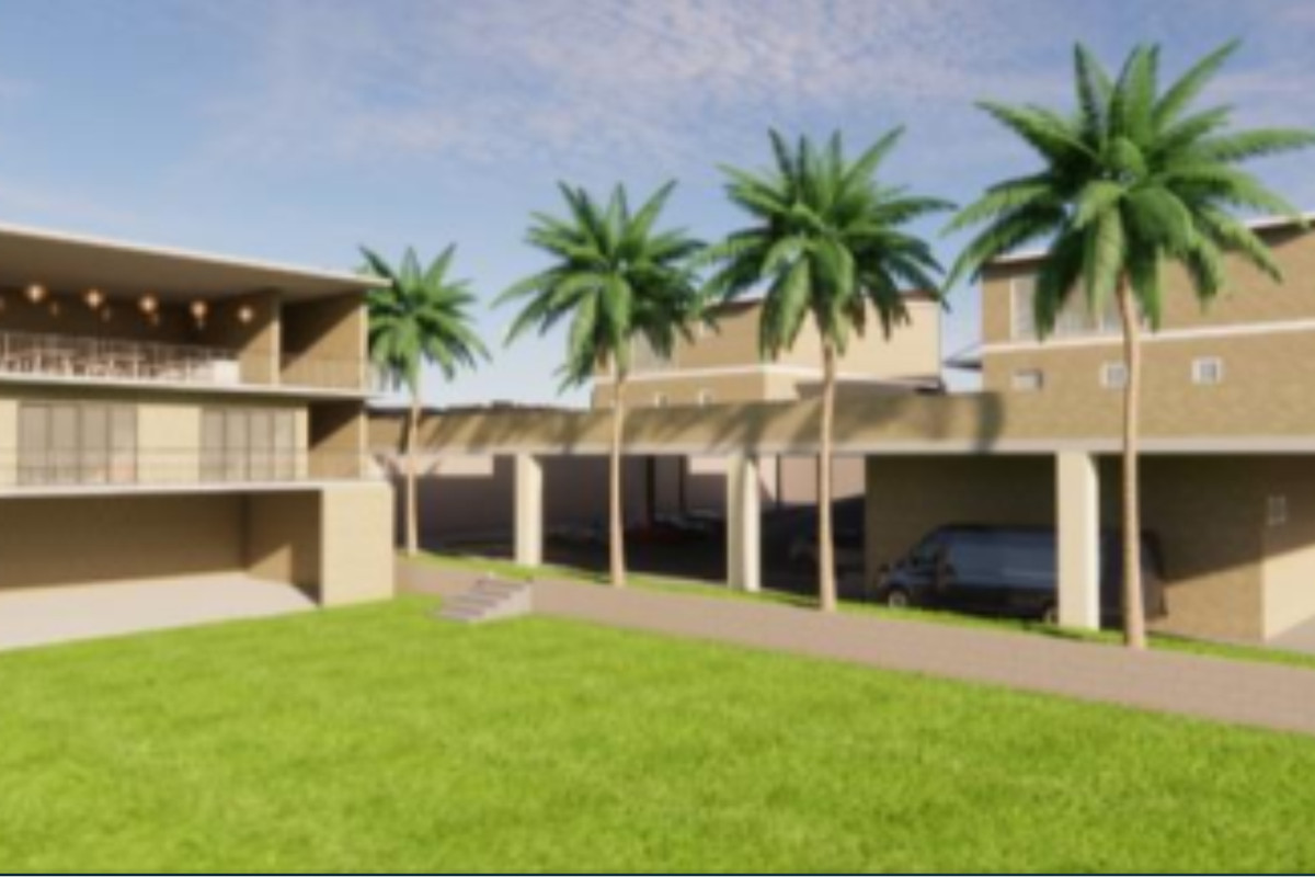 A rear view of a multi-level property featuring a covered patio, balcony, and expansive lawn area with structural concrete pillars.