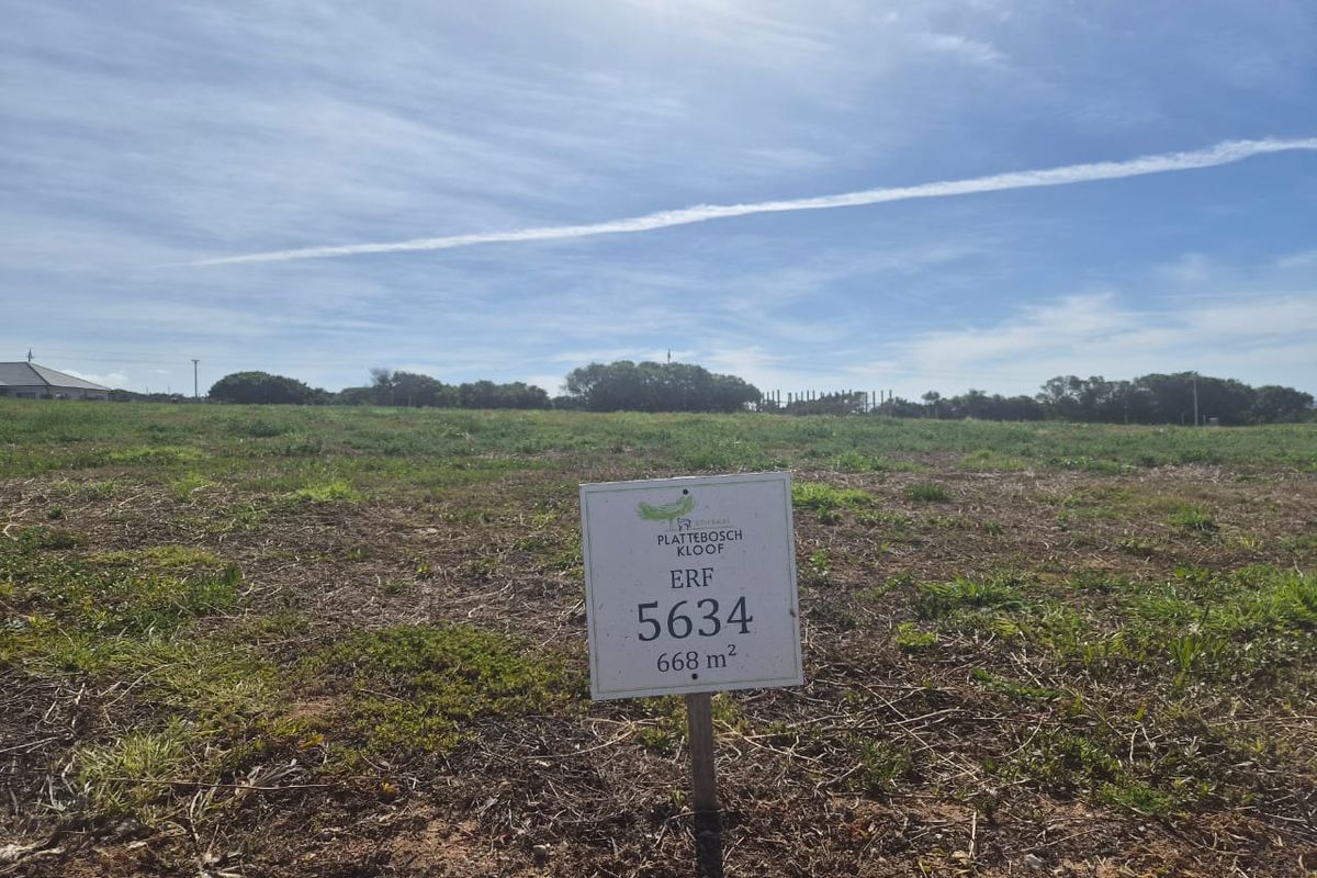 A view of a vacant residential plot of land measuring 668 square meters, featuring natural vegetation and clear boundaries.