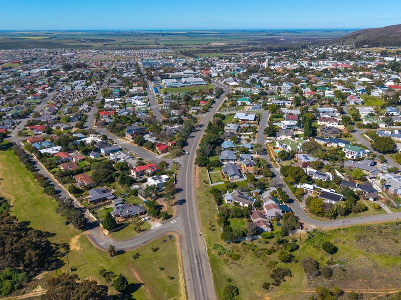 An elevated aerial view showcasing the surrounding residential neighborhood and local landscape infrastructure.