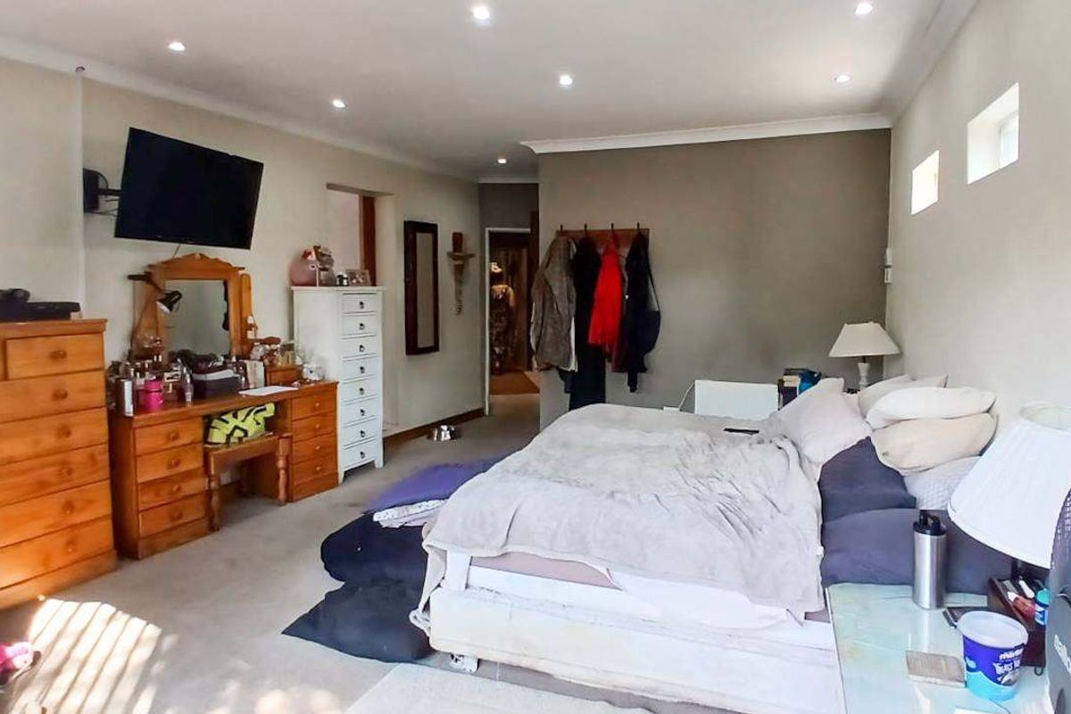 Spacious bedroom featuring recessed downlighting and coving, offering a comfortable layout with ample room for furniture.