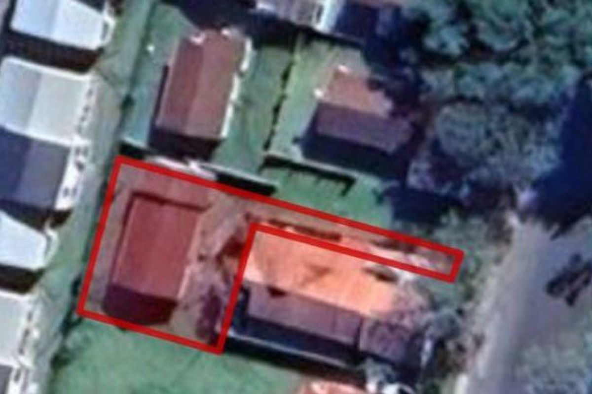 An aerial satellite view showing the property layout and roof structure with a red outline indicating the boundary.
