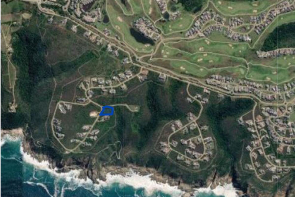 An aerial view of the residential estate showing the location of the vacant land plot within the coastal development.