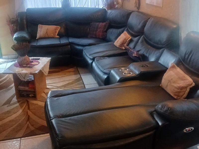 A living room area featuring tiled flooring, providing a functional space for relaxation and entertainment.