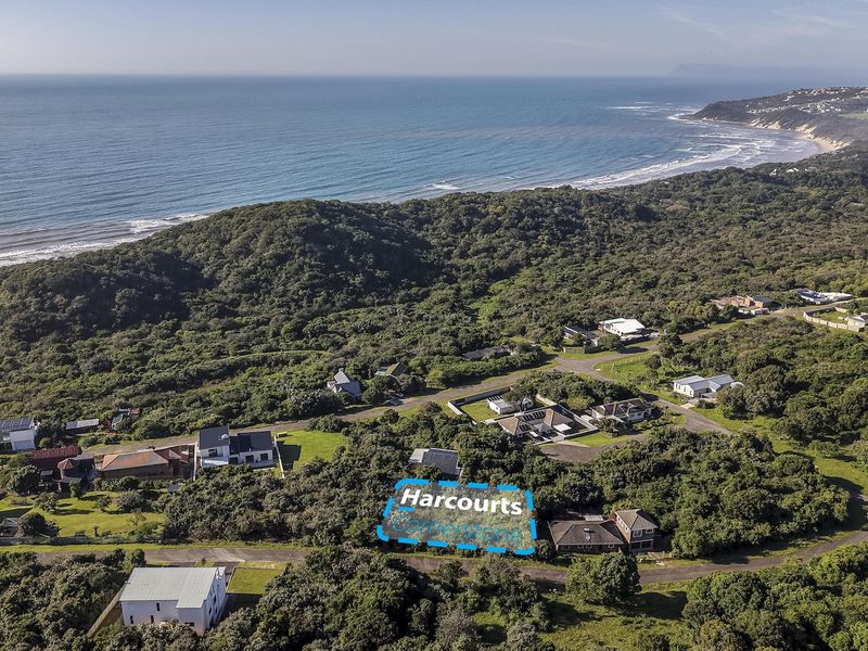 An aerial view of the residential area and surrounding coastal landscape, highlighting the property location within the natural environment.