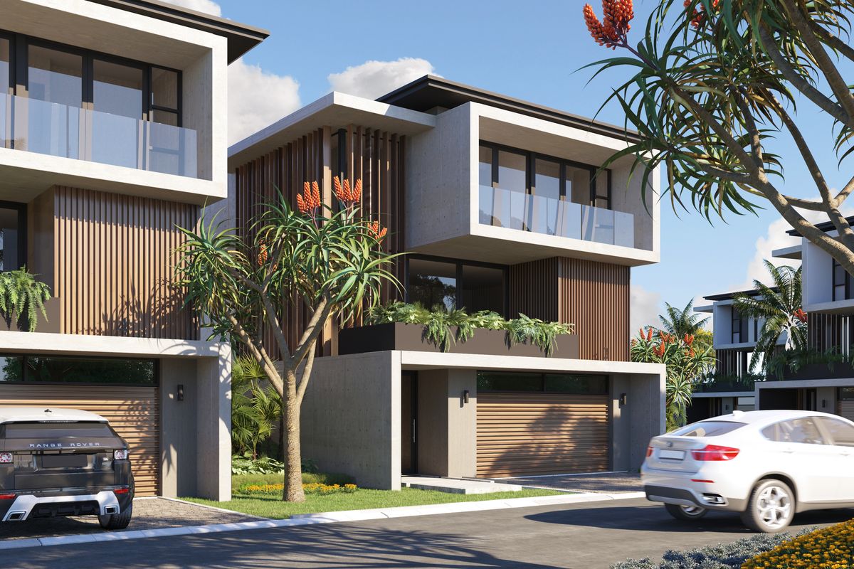 Modern townhouse exterior featuring contemporary concrete and timber architectural design with integrated double garages and private balconies.