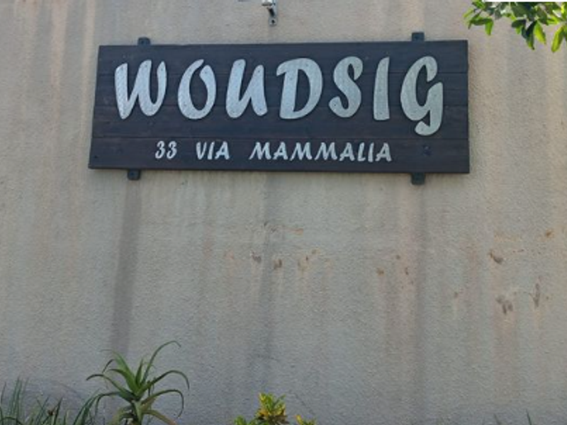 Exterior signage for the Woudsig apartment complex located at 33 Via Mammalia.