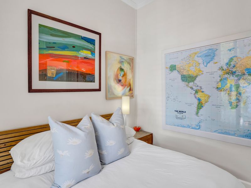A well-maintained bedroom featuring neutral walls and clean finishes, providing a comfortable and inviting sleeping space.