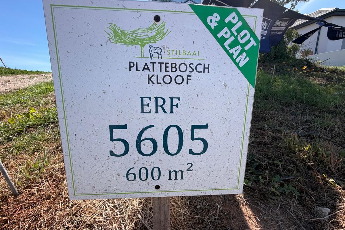 A real estate signage board for a 600 square meter residential erf in Plattebosch Kloof, Stilbaai, indicating a plot and plan opportunity.