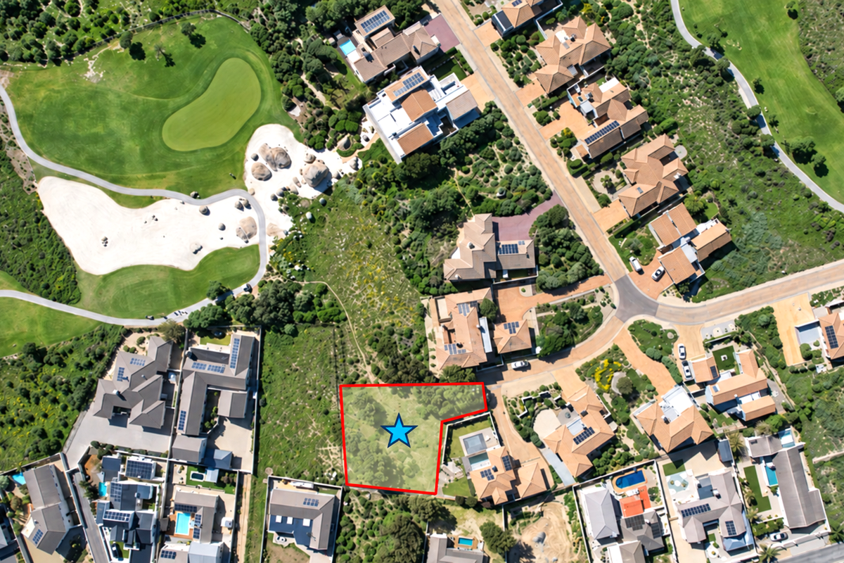 Aerial view of a vacant residential land plot situated within a developed estate, adjacent to a golf course.