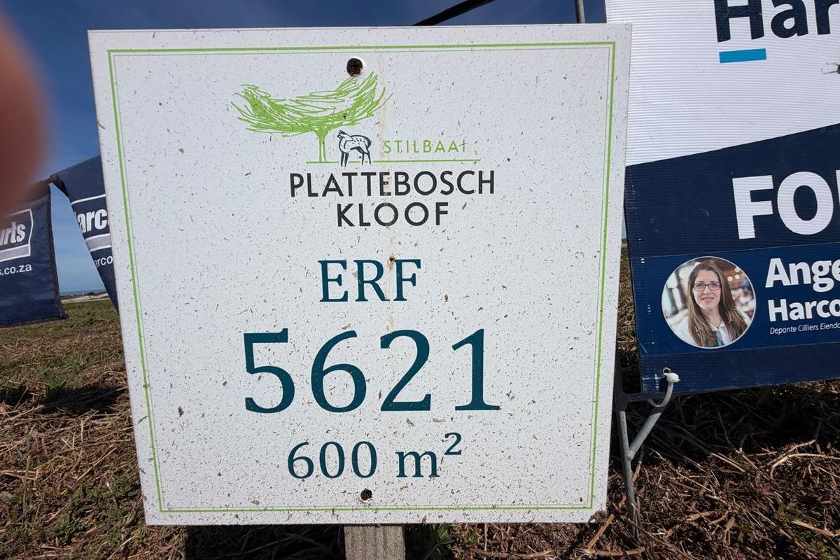 A real estate signage board displaying property details for Erf 5621 in Plattebosch Kloof, Stilbaai, indicating a 600 square meter residential plot.