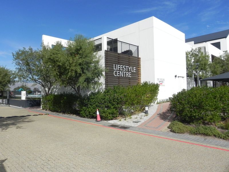 Exterior view of the modern apartment complex lifestyle centre featuring clean architectural lines and landscaped surroundings.